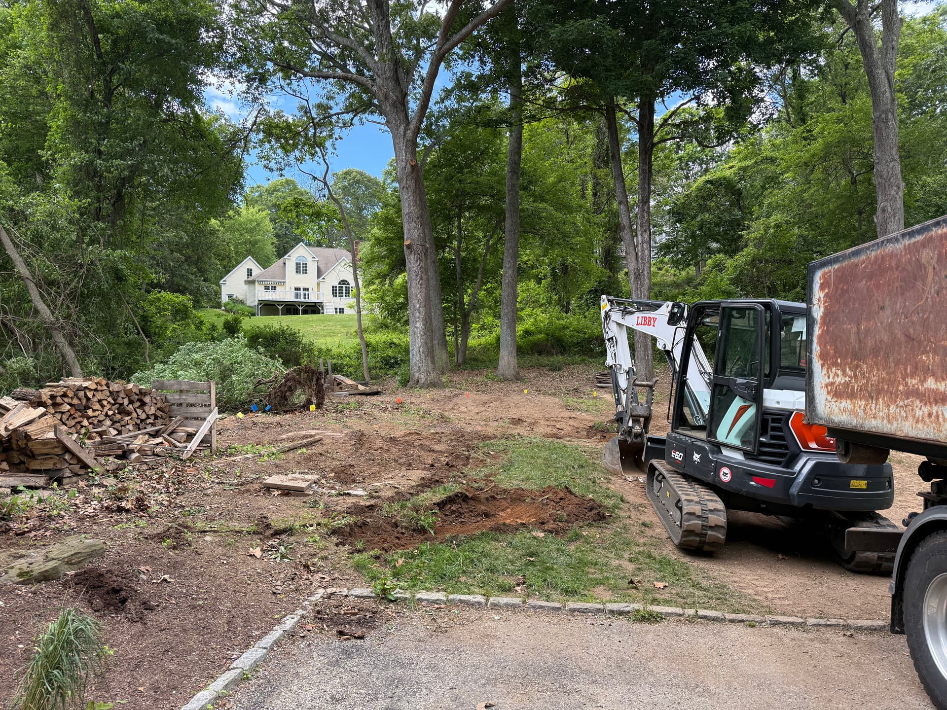 Gallery photos for Slope Excavation and Boulder Retaining Wall Base Build: Image #1