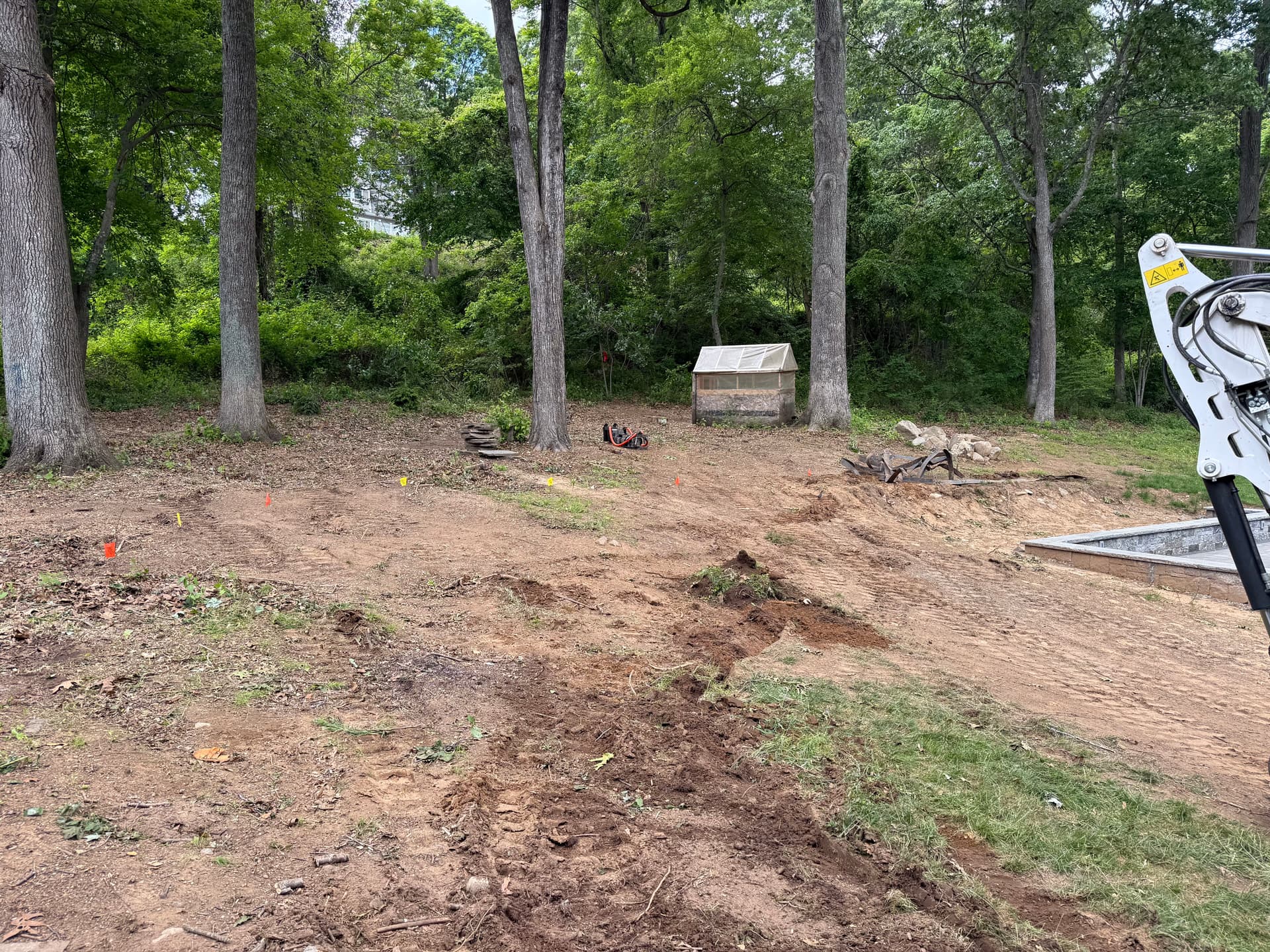 Slope Excavation and Boulder Retaining Wall Base Build image