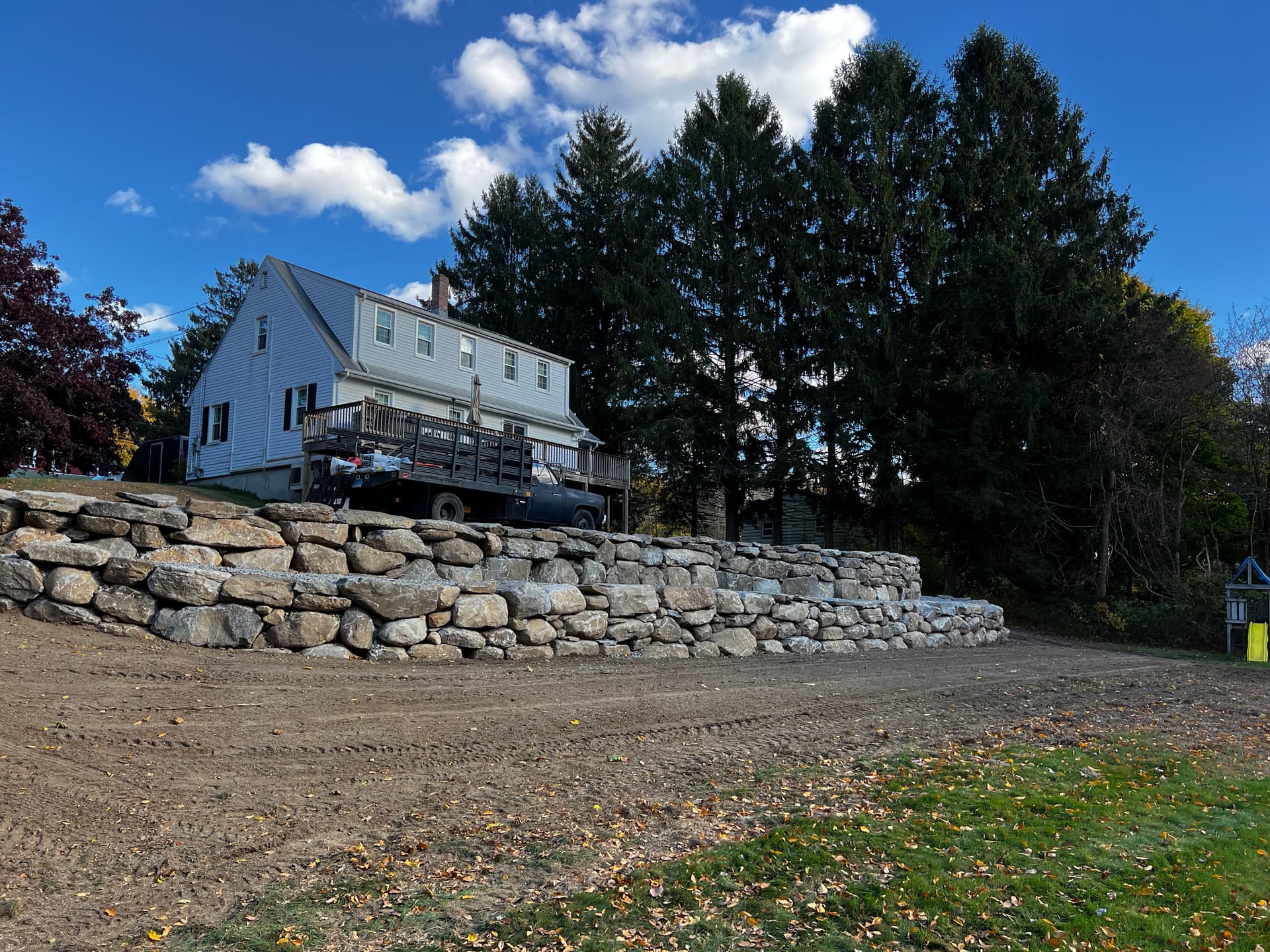 Enhanced Outdoor Space with Retaining Wall