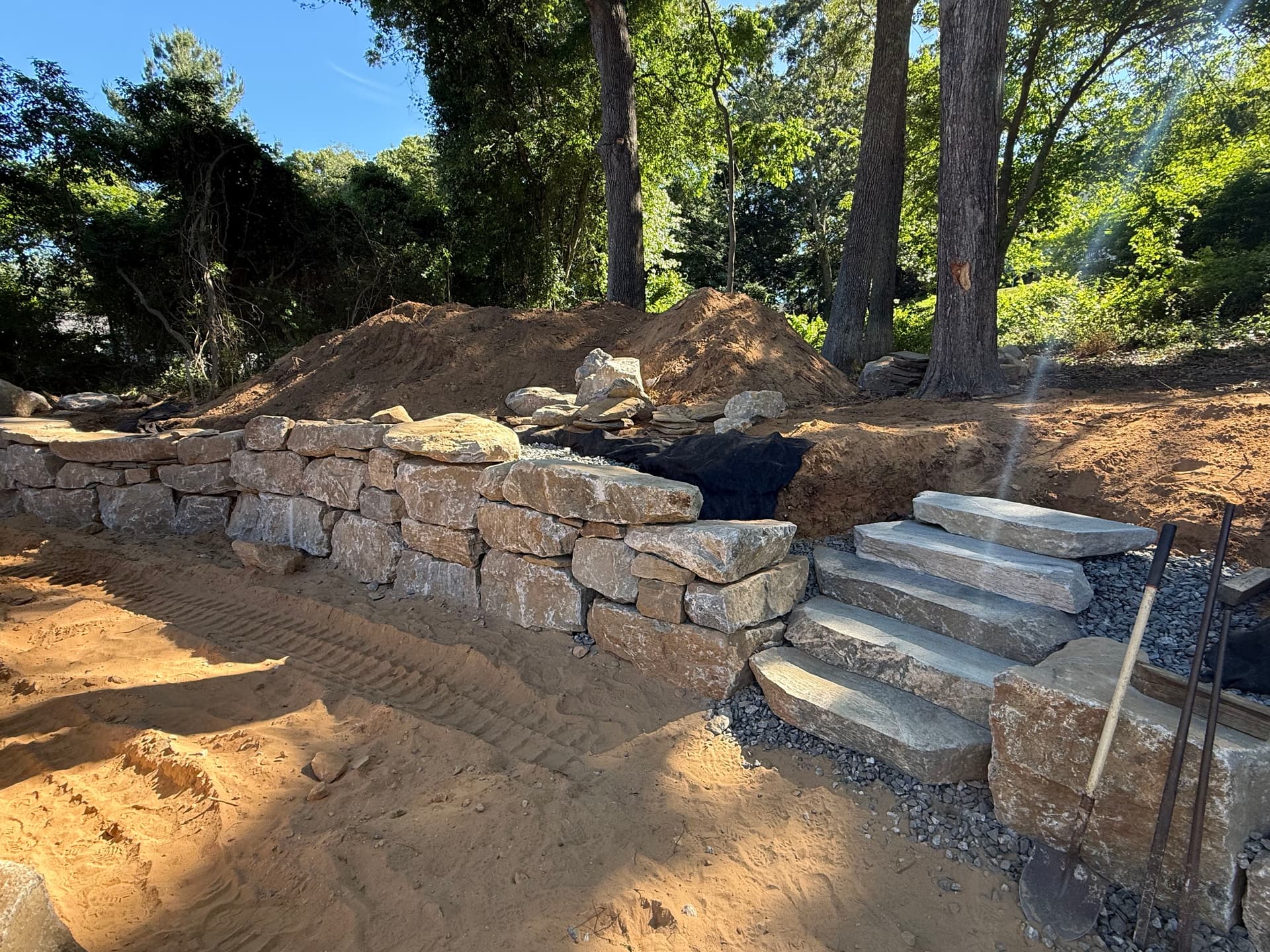 Gallery photos for Boulder Retaining Wall and Stone Steps Built for a Sloped Property: Image #1